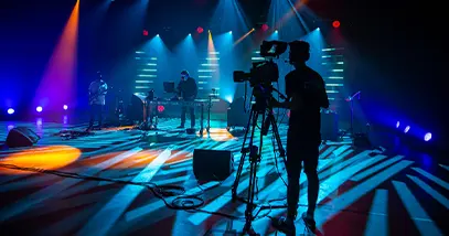 SSE & CO joined forces with Solotech a cameraman and a dj in a studio with blue lights