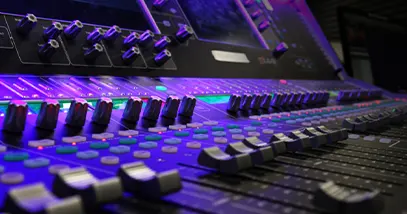 SSE & CO joined forces with Solotech closeup of a mix table and faders